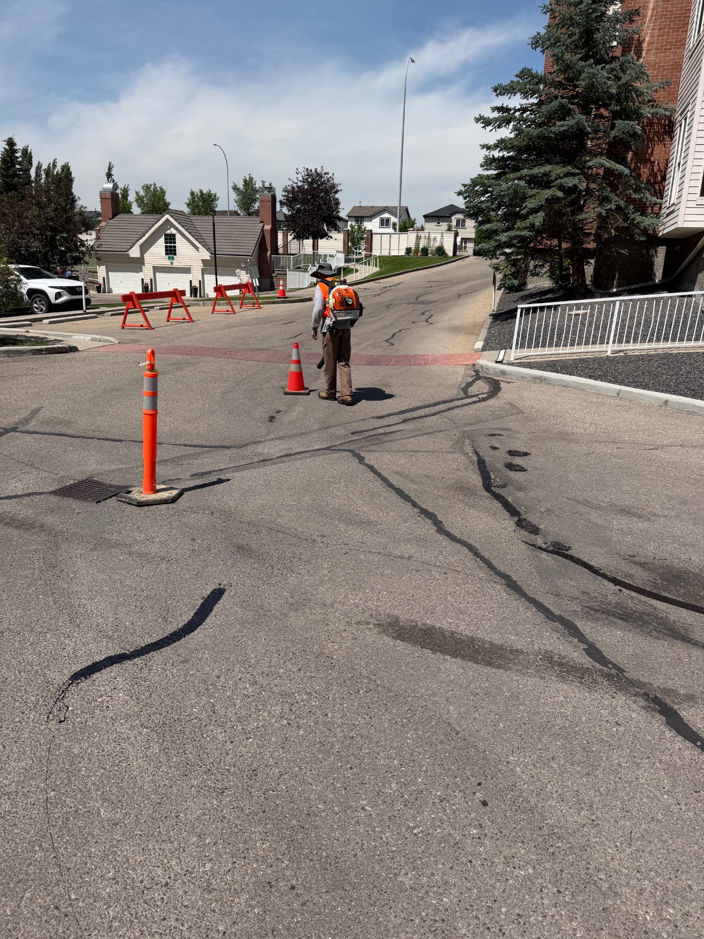 Cracked and faded commercial parking lot before restoration in Calgary