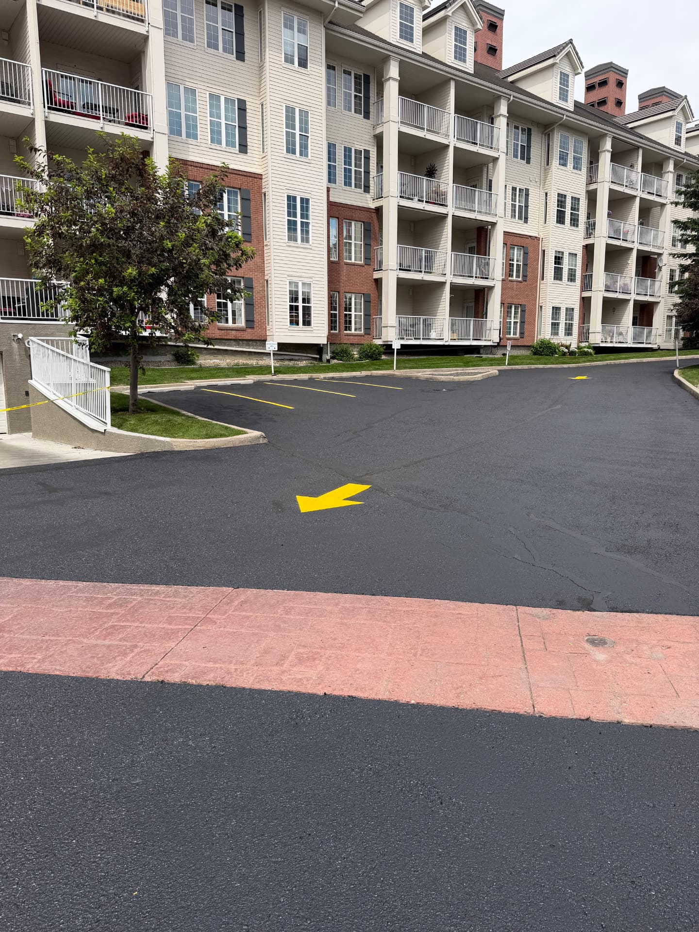 Church parking area in Calgary with new yellow directional arrows and stall lines