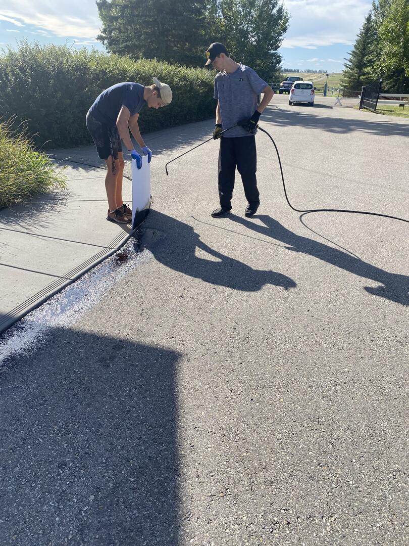 Cracks sealed with hot rubber crack filler